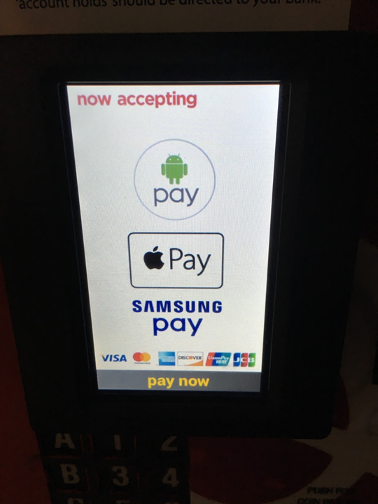 Closeup view of the mobile device payment interface, showing the flavors of payment systems supported (Apple Pay, Android Pay, Samsung Pay), as well as the credit card types supported.